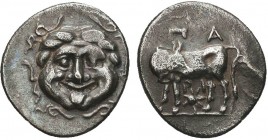 Greek, Mysia, c. 4th Century BC, AR Hemidrachm, Parion . Obverse: Facing gorgoneion with open mouth and tongue protruding Reverse: ΠA–PI, bull standin...