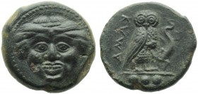 Sicily, Kamarina, Tetras, c. 420-405 BC; AE (g 3,44; mm 15; h 12); Gorgoneion, Rv. KAMA, owl standing r., holding lizard; in ex. three pellet. CNS III...