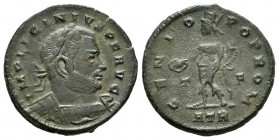 Licinio I. Follis. 313 d.C. Treveri. (Ric-119). Rev.: GENIO POP ROM / T F / ATR. Genio de pie izquierda con pátera y cuerno de la abundancia . Ae. 3,4...
