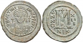 Justinian I, 527-565. Follis (Bronze, 44 mm, 21.51 g, 7 h), Nicomedia, 2nd officina, RY 13 = 539/40. D N IVSTINI-ANVS P P AVC Diademed, helmeted and c...