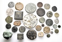 A lot containing 6 silver, 9 bronze coins, 3 bronze weights and 5 lead seals. Includes: Greek, Roman Provincial, Byzantine, Islamic. Fine to very fine...