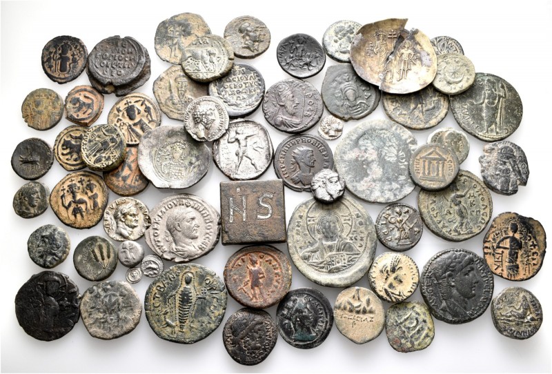 A lot containing 1 electrum (broken), 11 silver, 45 bronze coins, 1 lead seal an...