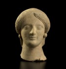A refined portrait of a female 
Magna Graecia, early 5th century BC; alt. cm 12; A beautiful female head cast with a mould, details delicately incise...