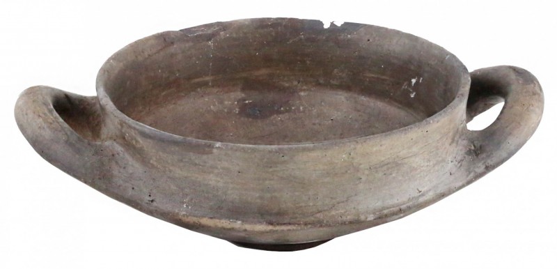 A two-handled clay vessel
Etruria, 9th – 8th century BC; diam. cm 17,5; alt. cm...