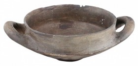 A two-handled clay vessel
Etruria, 9th – 8th century BC; diam. cm 17,5; alt. cm 8; A grey clay bowl with a round rim, deep basin, flat bottom and sma...