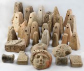 A collection of loom weights
5th – 3rd century BC ; alt. max cm 10; Group of 29 loom weights and two spools. Some figured, others characterized by Gr...
