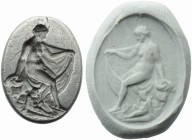 Roman silver Venus and Eros Intaglio
1st century AD; alt. mm 20; gr 5,58; Silver Intaglio depicting Venus, naked and seated on a rock, with a strip o...