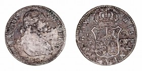 Carlos IV
2 Reales. AR. Sevilla CN. 1806. 5.61g. Cal.1069. Pátina oscura e irregular. BC.
