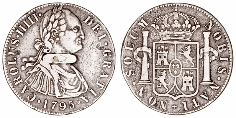 Carlos IV
Metal blanco. (1795). Botón de Gauchos imitando un real de ocho (Caro...