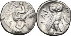 Greek Italy. Southern Apulia, Tarentum. AR Drachm, 302-280 BC. D/ Head of Athena right, wearing helmet decorated with Scylla. R/ Owl standing right; b...