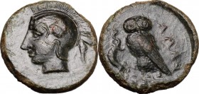 Sicily. Kamarina. AE Tetras, 425-405 BC. D/ Head of Athena left, helmeted. R/ Owl standing left, head facing, holding lizard; in exergue, three pellet...
