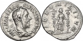 Macrinus (217-218). AR Denarius. D/ Laureate, draped and cuirassed bust right. R/ Fides standing facing, head right, right foot on helmet, holding sta...