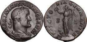 Maximinus (235-238). AE Sestertius, 236-238. D/ Bust right, laureate, draped, cuirassed. R/ Victory standing left, holding wreath and palm; to feet, s...