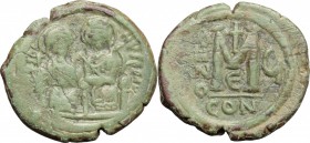 Justin II, with Sophia (565-578). AE Follis. Constantinople mint, 5th officina. Dated RY 6 (570/1). D/ Nimbate figures of Justin and Sophia seated fac...