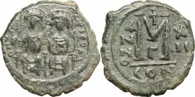 Justin II (565-578). AE Follis. Constantinople mint, 3rd officina. Dated RY 12 (576/7). D/ Nimbate figures of Justin and Sophia seated facing on doubl...