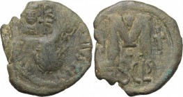 Heraclius (610-641). AE Follis. Syracuse mint. Struck 615/6-627/8. Countermarked on a follis of Justin I, struck 518-522 (Sear 64). D/ Crowned and dra...