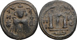 Arab-Byzantine, Umayyad Caliphate. AE Fals, Hims (Emesa) mint, c. 680-693. D/ Facing imperial bust, holding globus cruciger; KAΛωN to left, bi-hims to...