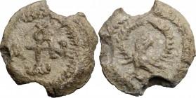 PB Seal, 8th-12th century. D/ Cruciform invocative monogram. R/ Eagle with wing spread within wreath. Lead. g. 8.77 mm. 22.00 VF.