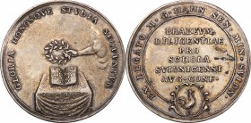 Germany. AR School price medal of the Protestant School of of Schweidnitz, Silesia, before 1865,. D/ Hand placing laurel wreath on book placed on tabl...