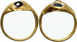 Gold double ring with glasspaste inlaids. Roman period, 1st-3rd century AD. Size 14.75mm. 18 mm. 2.66 g.