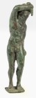 OBJEKTE AUS BRONZE. 
FIGUREN. 
Kleine Statuette römisch 1. - 3. Jh. n. Chr., stehender Papposilen auf kleiner rechteckiger Platte, hält Phallos (?) ...