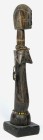 AFRIKANA. 
BURKINA FASO. 
MOSSI. Biga-Puppe, abstrahierte konische Figur mit 2 Spitzbrüsten, scheibenförmiger Kopf mit Kammfrisur, auf Holzsockel H....