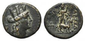 Cilicia, Tarsos, c. 164-27 BC. Æ (15mm, 3.57g, 12h). Turreted and draped bust of Tyche r. R/ Sandan advancing r. with goat; two monograms in l. field....