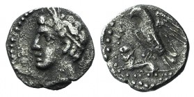 Cilicia, Uncertain, c. 4th century BC. AR Obol (9mm, 0.66g, 12h). Youthful male head (Triptolemos?) l., wearing grain wreath. R/ Eagle l. on lion's ba...