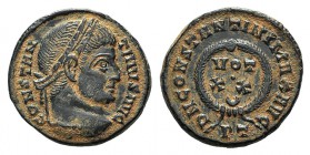 Constantine I (307/310-337). Æ Follis (18mm, 3.69g, 6h). Ticinum, 322-325. Laureate head r. R/ Laurel-wreath enclosing VOT/•/XX-crescent//PT. RIC VII ...