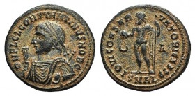 Constantine II (Caesar, 316-337). Æ Follis (19mm, 3.17g, 6h). Alexandria, 317-320. Laureate bust l., wearing imperial mantle, holding globe, sceptre a...