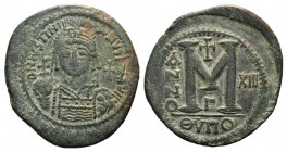 Justinian I (527-565). Æ 40 Nummi (43mm, 21.55g, 5h). Theoupolis (Antioch), year 13 (539/40). Helmeted and cuirassed bust facing, holding globus cruci...