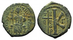 Justinian I (527-565). Æ 20 Nummi (27mm, 8.00g, 11h). Theoupolis (Antioch). Justinian enthroned facing, holding cross on globe and long sceptre. R/ La...