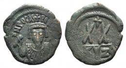 Phocas (602-610). Æ 20 Nummi (23mm, 5.82g, 12h). Cyzicus. Crowned bust facing, wearing consular robes, and holding mappa and cross. R/ Large XX; cross...
