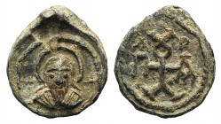 Byzantine, Uncertain, c. 6th-7th century. PB Seal (19mm, 5.80g, 12h). Facing nimbate bust of John the Baptist(?); crosses flanking. R/ Cruciform monog...