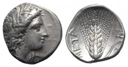 Southern Lucania, Metapontion, c. 325-275 BC. AR Stater (21mm, 7.83g, 6h). Head of Demeter r., wearing grain-ear wreath and earring. R/ Barley ear, le...