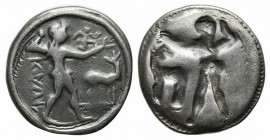 Bruttium, Kaulonia, c. 525-500 BC. AR Stater (22mm, 7.34g, 12h). Apollo advancing r., holding branch; small daimon running r. on Apollo's l. arm; to r...