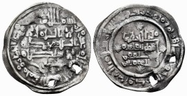 Hammudids. Al Qasim. Dirham. 410 H. Medina Sabta. (V-739). Ag. 2,60 g. Dos perforaciones de época. Rara. Choice VF. Est...90,00.