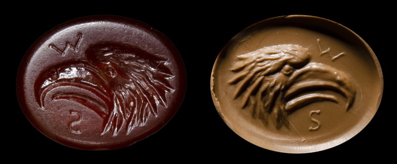 A large roman carnelian intaglio. Head of eagle and initials.
1st - 2nd century...
