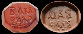 A roman carnelian intaglio. Inscription.
2nd-3rd century A.D.
12 x 10 x 4 mm

Octogonal bezel. Slight wear marks.
