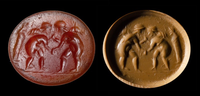 A roman carnelian intaglio. Winged erotes fighting.
2nd - 3rd century A.D.
11 ...