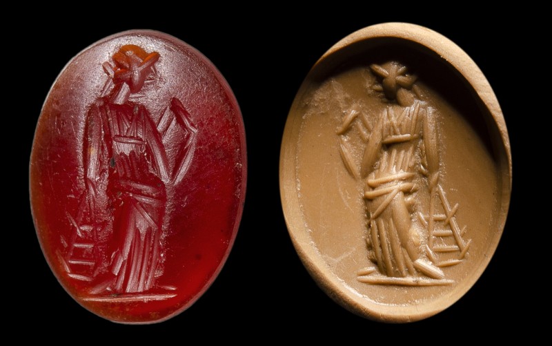 A roman carnelian intaglio. Priestress.
2nd century A.D.
9 x 11 x 3 mm

The ...