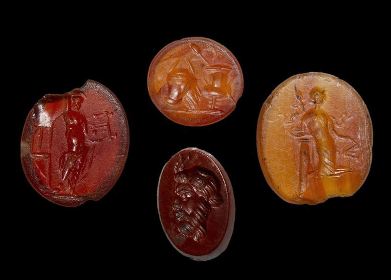 A lot of 4 roman red jasper and carnelian intaglios. Various subjects.
2nd - 3r...