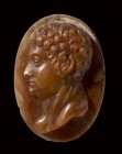 A postclassical agate cameo. Male bust. 
16th - 18th century
19 x 26 x 6 mm

The young character is facing left and characterized by a muscular ne...
