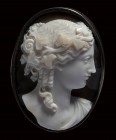 A fine neoclassical two-layers agate cameo set in a silver brooch. Bust of Bacchus. 
19th century
34 x 46 x 18 mm 

The young god of drunkness is ...