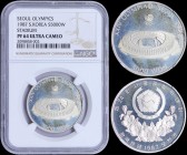 SOUTH KOREA: 5000 Won (1987) in silver (0,925) from 1988 Olympics Series. Obv: Arms above floral spray. Rev: Stadium. Inside slab by NGC "PF 64 ULTRA ...