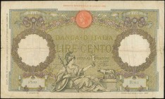 ITALY: 100 Lire (29.1.1938) in olive and brown with Roma reclining with spear and shield holding Victory and wolf with twins at bottom center. S/N: "B...