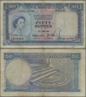 Ceylon: 50 Rupees 1952, P.52, rare banknote, small graffiti at lower center on front and lightly toned paper. Condition: F
 [differenzbesteuert]