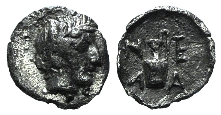 Troas, Neandria, 4th century BC. AR Tetartemorion (6mm, 0.21g, 12h). Laureate he...