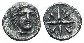 Satraps of Caria, Pixodaros (c. 341/0-336/5 BC). AR Obol (8mm, 0.78g). Halikarnassos, c. 340-334 BC. Facing head of Apollo. R/ Eight-rayed star. SNG K...
