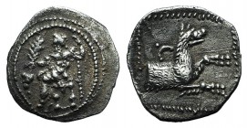 Lycaonia, Laranda, c. 324/3 BC. AR Obol (12mm, 0.76g, 6h). Baaltars seated l., holding grain ear, grape bunch, and sceptre. R/ Forepart of wolf r.; in...